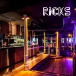 RICK’S logo